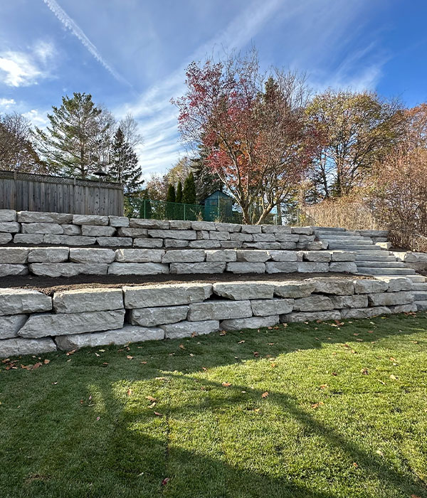 Decorative retaining wall stone in backyard